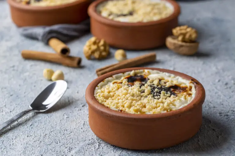 Baked Rice Pudding (Sütlaç) - A Turkish Dessert Worth Mastering 7 Baked rice pudding turkish milky dessert sutlac in earthenware casserole with hazelnuts