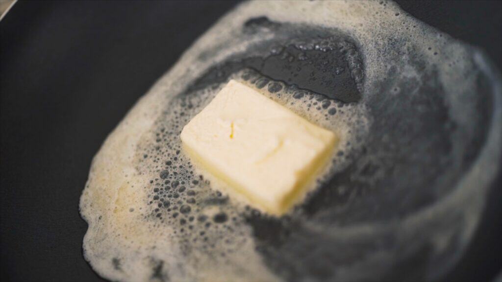 Close of of butter in a skillet